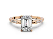 Solitaire Engagement Ring Setting for Emerald Cut Center with Channel Accents and Prong Head in Rose Gold