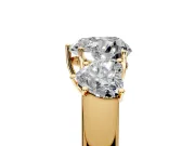 3 Stone Engagement Ring Setting for Heart-Shaped Center with Raised Basket Heads and Prong Head in Yellow Gold