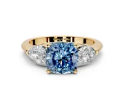 3 Stone Engagement Ring Setting for Fancy Blue Cushion Cut Center with Large Pear-Shaped Accents and Prong Head in Yellow Gold