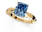 Solitaire Engagement Ring Setting for Fancy Blue Radiant Cut Center with Carved Leaf Shoulders and Prong Head in Yellow Gold