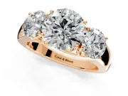 3 Stone Engagement Ring Setting for Round Cut Center with Raised Basket Heads and Prong Head in Rose Gold