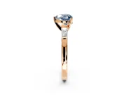 3 Stone Engagement Ring Setting for Fancy Blue Heart-Shaped Center with Tapered Baguettes, Plain Band and Prong Head in Rose Gold