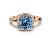 Halo Engagement Ring Setting for Fancy Blue Cushion Cut Center with Pave and Plain Twist Band and Prong Head in Rose Gold