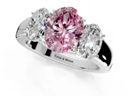 3 Stone Engagement Ring Setting for Fancy Pink Oval Center with Raised Basket Heads and Prong Head in Platinum