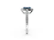 Bezel-Framed Halo Engagement Ring Setting for Fancy Blue Emerald Cut Center with Pave Band and Prong Head in Platinum