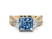 3 Stone Engagement Ring Setting for Fancy Blue Princess Cut Center with Pave Twist Band and Prong Head in Yellow Gold