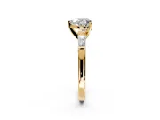 3 Stone Engagement Ring Setting for Heart-Shaped Center with Tapered Baguettes, Plain Band and Prong Head in Yellow Gold