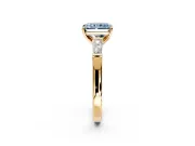 3 Stone Engagement Ring Setting for Fancy Blue Radiant Cut Center with Tapered Baguettes, Plain Band and Prong Head in Yellow Gold
