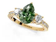 3 Stone Engagement Ring Setting for Fancy Green Pear-Shaped Center with Round Cut Side Accents and Prong Head in Yellow Gold