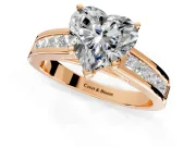 Solitaire Engagement Ring Setting for Heart-Shaped Center with Princess Cut Channel Band and Prong Head in Rose Gold