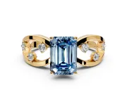 Solitaire Engagement Ring Setting for Fancy Blue Emerald Cut Center with Criss-Cross Accent Band and Prong Head in Yellow Gold