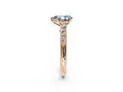Cluster Engagement Ring Setting for Fancy Blue Pear-Shaped Center with Round Cut Accent Band and Prong Head in Rose Gold