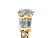 Channel-Set Engagement Ring Setting for Round Cut Center with Baguette Band and Prong Head in Yellow Gold