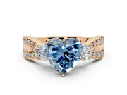 3 Stone Engagement Ring Setting for Fancy Blue Heart-Shaped Center with Pave Twist Band and Prong Head in Rose Gold
