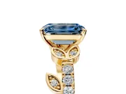 Leaf Motif Engagement Ring Setting for Fancy Blue Emerald Cut Center with Pave Band and Prong Head in Yellow Gold