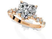 Solitaire Engagement Ring Setting for Heart-Shaped Center with Trailing Leaf Accent Band and Prong Head in Rose Gold