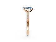 Solitaire Engagement Ring Setting for Fancy Blue Pear-Shaped Center with Channel Accents and Prong Head in Rose Gold