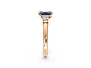 3 Stone Engagement Ring Setting for Fancy Blue Emerald Cut Center with Wide Plain Band and Prong Head in Rose Gold