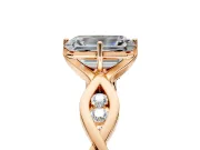 Solitaire Engagement Ring Setting for Emerald Cut Center with Accented Twist Band and Leaf Prong Head in Rose Gold