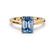 Solitaire Engagement Ring Setting for Fancy Blue Emerald Cut Center with Narrow Cathedral Band and Prong Head in Yellow Gold