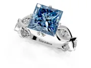 Solitaire Engagement Ring Setting for Fancy Blue Princess Cut Center with Accented Twist Band and Leaf Prong Head in Platinum
