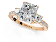 3 Stone Engagement Ring Setting for Radiant Cut Center with Round Cut Side Accents and Prong Head in Rose Gold