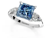 3 Stone Engagement Ring Setting for Fancy Blue Princess Cut Center with Large Pear-Shaped Accents and Prong Head in Platinum