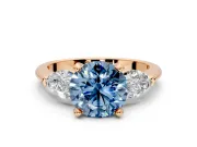 3 Stone Engagement Ring Setting for Fancy Blue Round Cut Center with Large Pear-Shaped Accents and Prong Head in Rose Gold