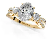 3 Stone Engagement Ring Setting for Oval Center with Pave Split Shank and Prong Head in Yellow Gold