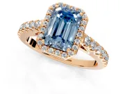 Halo Engagement Ring Setting for Fancy Blue Emerald Cut Center with Full Pave Band and Prong Head in Rose Gold