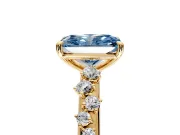 Cluster Engagement Ring Setting for Fancy Blue Radiant Cut Center with Round Cut Accent Band and Prong Head in Yellow Gold