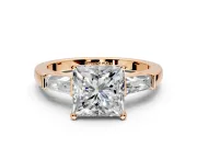 3 Stone Engagement Ring Setting for Princess Cut Center with Tapered Baguettes, Plain Band and Prong Head in Rose Gold