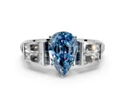 Channel-Set Engagement Ring Setting for Fancy Blue Pear-Shaped Center with Baguette Band and Prong Head in Sterling Silver
