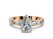 Solitaire Engagement Ring Setting for Pear-Shaped Center with Channel Baguette Band and Prong Head in Rose Gold