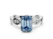 Solitaire Engagement Ring Setting for Fancy Blue Emerald Cut Center with Accented Twist Band and Leaf Prong Head in Platinum