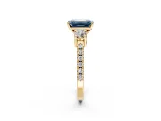 3 Stone Engagement Ring Setting for Fancy Blue Emerald Cut Center with Round Cut Side Accents and Prong Head in Yellow Gold