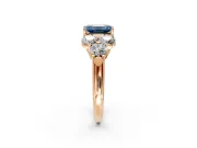Cluster Engagement Ring Setting for Fancy Blue Emerald Cut Center with Round Cut Accent Frame and Prong Head in Rose Gold