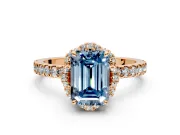 Halo Engagement Ring Setting for Fancy Blue Emerald Cut Center with Openwork Halo, Pave Band and Prong Head in Rose Gold