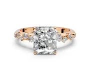 Cluster Engagement Ring Setting for Radiant Cut Center with Round Cut Accent Band and Prong Head in Rose Gold