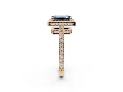 Halo Engagement Ring Setting for Fancy Blue Emerald Cut Center with Metal-Rimmed Halo, Pave Band and Prong Head in Rose Gold