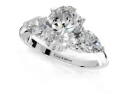 3 Stone Engagement Ring Setting for Oval Center with Large Pear-Shaped Accents and Prong Head in Platinum