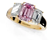 3 Stone Engagement Ring Setting for Fancy Pink Emerald Cut Center with Raised Basket Heads and Prong Head in Yellow Gold
