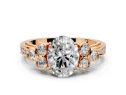 Cluster Engagement Ring Setting for Oval Center with Bezel Accent Clusters and Prong Head in Rose Gold
