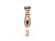 3 Stone Engagement Ring Setting for Fancy Blue Cushion Cut Center with Pave Twist Band and Prong Head in Rose Gold
