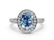 Bezel-Framed Halo Engagement Ring Setting for Fancy Blue Oval Center with Pave Band and Prong Head in Platinum