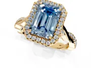 Halo Engagement Ring Setting for Fancy Blue Emerald Cut Center with Twist Band and Prong Head in Yellow Gold
