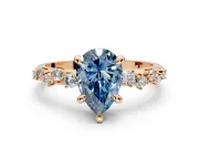 Solitaire Engagement Ring Setting for Fancy Blue Pear-Shaped Center with Trailing Leaf Accent Band and Prong Head in Rose Gold