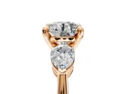 3 Stone Engagement Ring Setting for Round Cut Center with Large Pear-Shaped Accents and Prong Head in Rose Gold