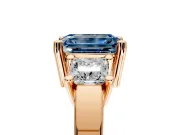 3 Stone Engagement Ring Setting for Fancy Blue Emerald Cut Center with Matching Side Accents and Prong Head in Rose Gold
