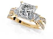3 Stone Engagement Ring Setting for Princess Cut Center with Pave Twist Band and Prong Head in Yellow Gold